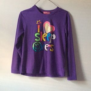 A ‘I love sleep overs’ pajamas shirt